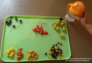 a sample of T's placemat: blueberries, strawberries, grapes, black beans & corn, chickpeas, tomatoes, & yellow carrots. 