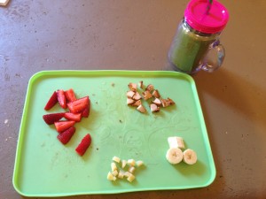 strawberries, chicken, cheese & banana with a side of green smoothie: kale, mustard greens, frozen fruit medley, 1/2 banana, flax seed & water