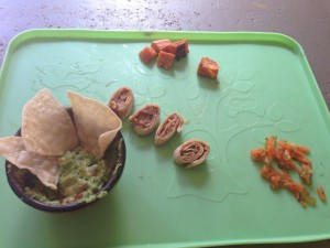 tortilla with almond butter, sweet potatoes, corn chips with homemade guacamole & healing movement orange blend cultured vegetables